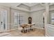 Elegant dining room featuring a wooden table, stylish chairs, and decorative trim at 6470 Indigo Bunting Pl, Lakewood Ranch, FL 34202