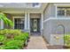 Inviting front entrance with a decorative glass door, stone accents, and manicured landscaping at 6470 Indigo Bunting Pl, Lakewood Ranch, FL 34202