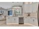 Bright kitchen with white cabinetry, stainless steel appliances, and seamless transition to living space at 6470 Indigo Bunting Pl, Lakewood Ranch, FL 34202