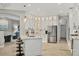 Bright kitchen features a large island, stainless steel refrigerator, and plenty of counter space at 6470 Indigo Bunting Pl, Lakewood Ranch, FL 34202