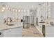 Modern kitchen with white cabinets, sleek countertops, and stainless steel appliances at 6470 Indigo Bunting Pl, Lakewood Ranch, FL 34202