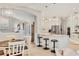 Gourmet kitchen with white cabinetry, a spacious island, and stainless steel appliances at 6470 Indigo Bunting Pl, Lakewood Ranch, FL 34202