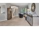 Open-concept living room with wood floors, neutral paint, and views of the outdoor area at 6470 Indigo Bunting Pl, Lakewood Ranch, FL 34202