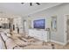 Spacious living room flowing into a bright, open kitchen with modern appliances and lots of cabinet space at 6470 Indigo Bunting Pl, Lakewood Ranch, FL 34202