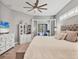 Serene main bedroom features soft textures, natural light, and French doors leading to screened patio at 6470 Indigo Bunting Pl, Lakewood Ranch, FL 34202