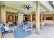Enjoy the spacious outdoor patio with ample seating and a large ceiling fan at 6470 Indigo Bunting Pl, Lakewood Ranch, FL 34202