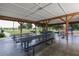 Covered picnic pavilion with multiple tables and benches in a park setting, perfect for gatherings at 6470 Indigo Bunting Pl, Lakewood Ranch, FL 34202