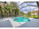 Lovely screened-in pool and spa surrounded by lush tropical landscaping at 6470 Indigo Bunting Pl, Lakewood Ranch, FL 34202