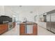 Bright and modern kitchen with an island, stainless steel appliances, and adjacent breakfast nook at 6504 Virginia Xing, University Park, FL 34201