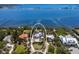 Panoramic aerial view of the waterfront property surrounded by lush greenery, showcasing its prime location and neighborhood at 705 89Th Nw Ct, Bradenton, FL 34209