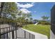 Enjoy lush landscaping and water views in the spacious backyard with an included boat lift at 705 89Th Nw Ct, Bradenton, FL 34209