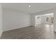 Finished basement with vinyl floors, an open concept and access to the yard at 705 89Th Nw Ct, Bradenton, FL 34209
