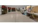Spacious basement with speckled floors, overhead lighting, and ample storage space at 705 89Th Nw Ct, Bradenton, FL 34209