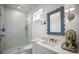 Elegant bathroom featuring a glass-enclosed shower, vanity with sink, and stylish fixtures at 705 89Th Nw Ct, Bradenton, FL 34209