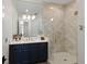Beautifully renovated bathroom features a glass walk-in shower, and a sleek vanity at 705 89Th Nw Ct, Bradenton, FL 34209