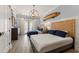 A delightful bedroom featuring two beds, stylish decor, and abundant natural light at 705 89Th Nw Ct, Bradenton, FL 34209