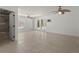 Brightly lit bedroom with beige tile floor, two ceiling fans and glass doors at 705 89Th Nw Ct, Bradenton, FL 34209