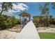 View of the boat lift and dock, perfect for enjoying waterfront activities at 705 89Th Nw Ct, Bradenton, FL 34209
