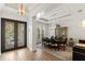 Formal dining room featuring a large table, stylish chandelier, and elegant decor for sophisticated entertaining at 705 89Th Nw Ct, Bradenton, FL 34209
