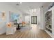 Grand foyer featuring an art display, chairs, decorative rug, and double front doors at 705 89Th Nw Ct, Bradenton, FL 34209