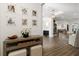 Spacious foyer featuring a console table, decor, and a view into the home's open floor plan at 705 89Th Nw Ct, Bradenton, FL 34209