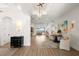 Welcoming entryway with wood floors, decorative lighting, and an open floor plan leading to the living area at 705 89Th Nw Ct, Bradenton, FL 34209