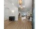 Elegant foyer with wood floors, decorative lighting, and seamless flow to the beautiful living spaces beyond at 705 89Th Nw Ct, Bradenton, FL 34209