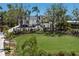 Stunning home with a lush green lawn, mature trees and manicured landscaping creating a picturesque setting at 705 89Th Nw Ct, Bradenton, FL 34209