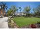 Expansive front yard with lush lawn and mature trees, offering a serene and inviting curb appeal at 705 89Th Nw Ct, Bradenton, FL 34209