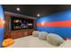 Comfortable home theater with a large screen, theater seating and custom millwork at 705 89Th Nw Ct, Bradenton, FL 34209