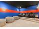 Home theater featuring tiered seating, a projector, and plush beanbag chairs at 705 89Th Nw Ct, Bradenton, FL 34209