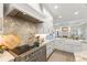 Elegant kitchen with a marble backsplash, custom cabinets, and open layout at 705 89Th Nw Ct, Bradenton, FL 34209
