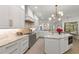 Luxury kitchen with marble countertops, stainless steel appliances, and stylish lighting at 705 89Th Nw Ct, Bradenton, FL 34209