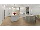 Spacious kitchen featuring an island, luxury finishes, and modern appliances at 705 89Th Nw Ct, Bradenton, FL 34209