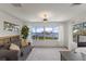 Inviting living room with expansive water views, comfortable seating and stylish decor at 705 89Th Nw Ct, Bradenton, FL 34209