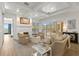 Comfortable living room with fireplace and sliding glass doors opening to outdoor living area with a pool at 705 89Th Nw Ct, Bradenton, FL 34209