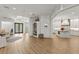 Open-concept living space with kitchen, luxury vinyl floors, and elegant design details at 705 89Th Nw Ct, Bradenton, FL 34209