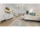 Bright main bedroom featuring a stylish decor, and a large TV at 705 89Th Nw Ct, Bradenton, FL 34209
