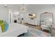 Bright main bedroom boasts a mini-bar, stylish decor, and a large TV at 705 89Th Nw Ct, Bradenton, FL 34209