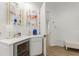 Elegant mini-bar features floating shelves, wine cooler, and ample counter space at 705 89Th Nw Ct, Bradenton, FL 34209