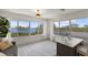 Bright office with water views, large windows, a comfortable chair and a modern desk at 705 89Th Nw Ct, Bradenton, FL 34209