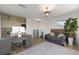 This office space includes a desk, couch, rug, and a view of the ornate spiral staircase at 705 89Th Nw Ct, Bradenton, FL 34209