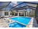 In-ground pool and hot tub with patio and outdoor spaces at 705 89Th Nw Ct, Bradenton, FL 34209