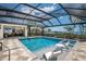 Enclosed in-ground pool, hot tub and patio featuring ocean views at 705 89Th Nw Ct, Bradenton, FL 34209