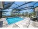 Enclosed in-ground pool with seating and ocean views at 705 89Th Nw Ct, Bradenton, FL 34209