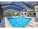 Relax in the sun in this beautiful screened-in outdoor pool with ample seating and space to entertain at 705 89Th Nw Ct, Bradenton, FL 34209