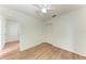 Bedroom showcasing a ceiling fan, closet doors and wood-look flooring at 7810 34Th E Ct, Sarasota, FL 34243