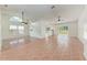 Open floor plan with tile and wood flooring and view of the kitchen at 7810 34Th E Ct, Sarasota, FL 34243