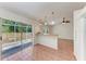 Bright, open kitchen area with sliding glass doors to the outdoors and a breakfast bar at 7810 34Th E Ct, Sarasota, FL 34243