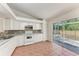 Bright kitchen with access to an outdoor screened area and offering ample cabinet space at 7810 34Th E Ct, Sarasota, FL 34243